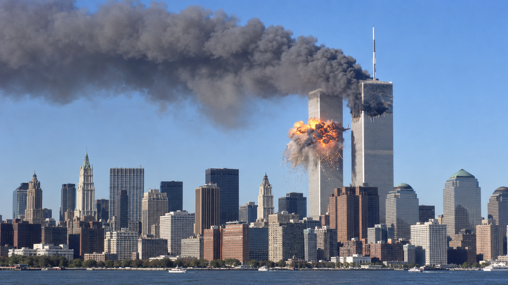 Smoke billows from the Twin Towers of the World Trade Center after a plane strikes the South Tower