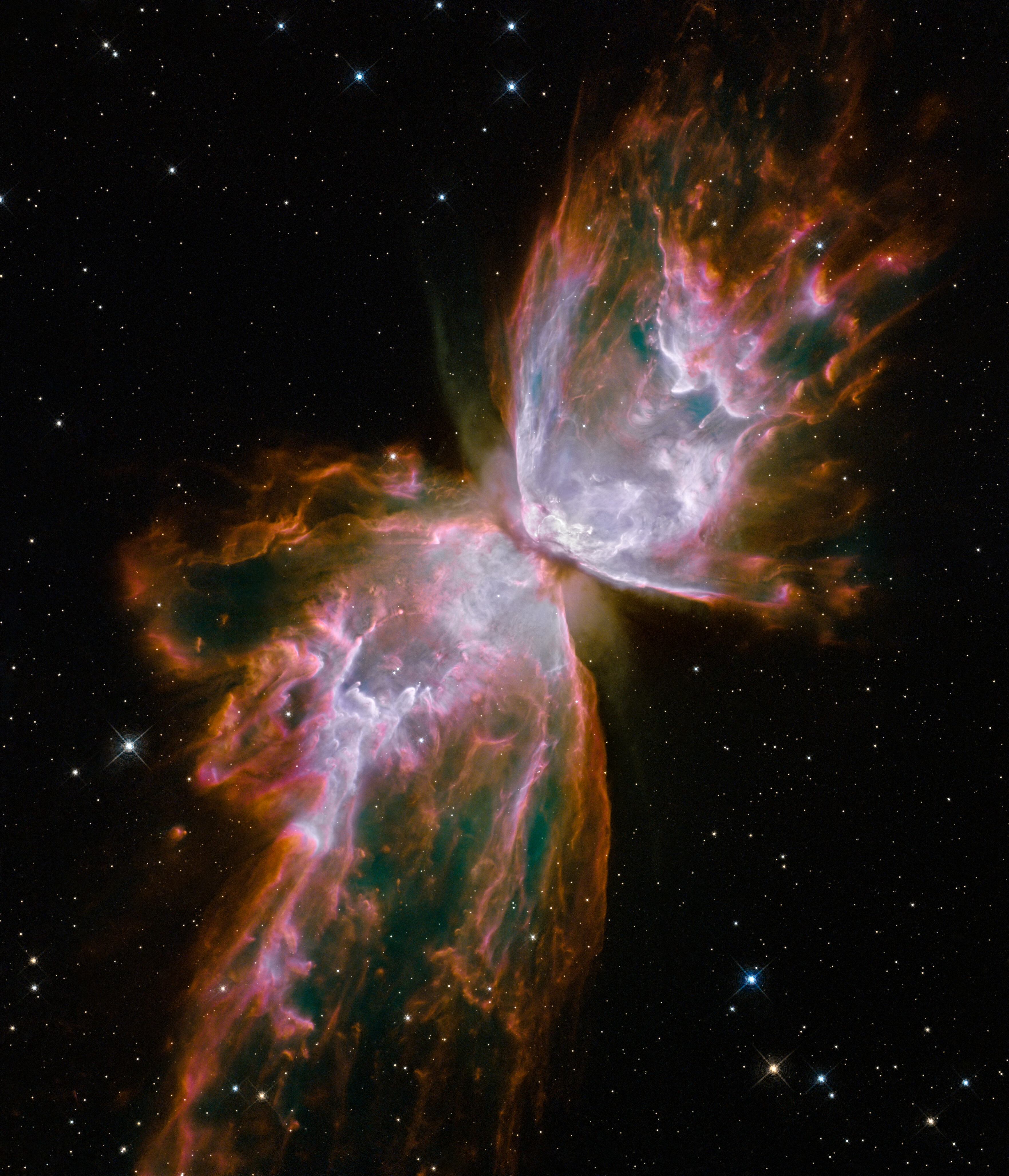 The Butterfly Nebula NGC 6302 photographed by the Hubble Space Telescope, showing two glowing lobes either side of a dark dust lane